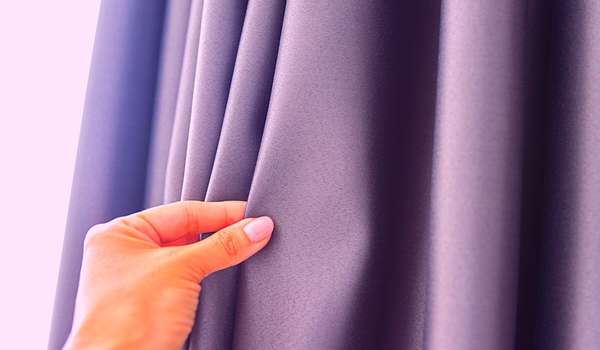 Hang curtains, drapes, or a sheer curtain to block out more of the light and create privacy.