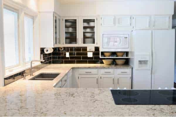 How Do I Keep My White Cabinets Clean When Paired With Black Countertops?