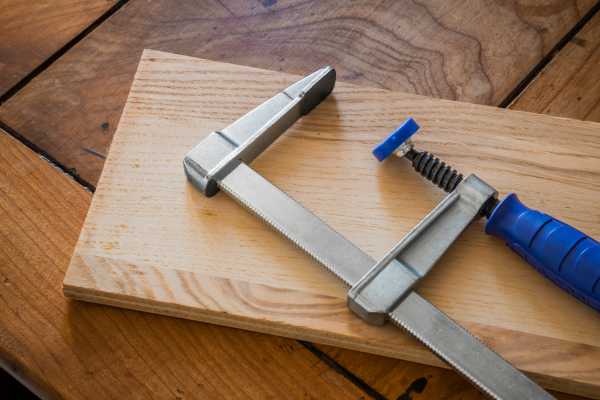 Using a Clamp or Weight to Flatten the Board